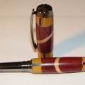 0069 - Jr. Gent Black Titanium Fountain Pen (23623 visits) This pen features barrels made with nearly 40 pieces of wood of various species. Each joint is lined... 0069 - Jr. Gent Black Titanium Fountain Pen